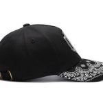 Baseball cap with metal element