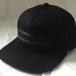 Embossed logo snap back cap