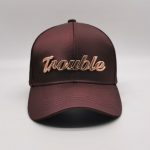 Trouble metaled label burgundy satin cap
