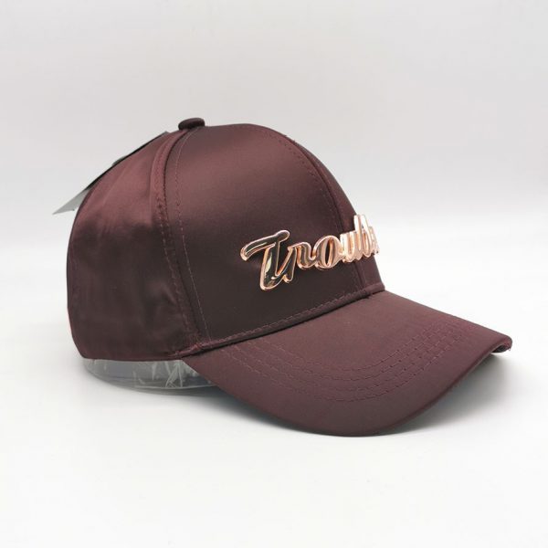 Trouble metaled label burgundy satin cap