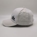 Cappellino da baseball in rilievo in tessuto con chiusura a strappo in rilievo