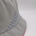 Light grey laser cut out floppy silver TPU branding bucket hat